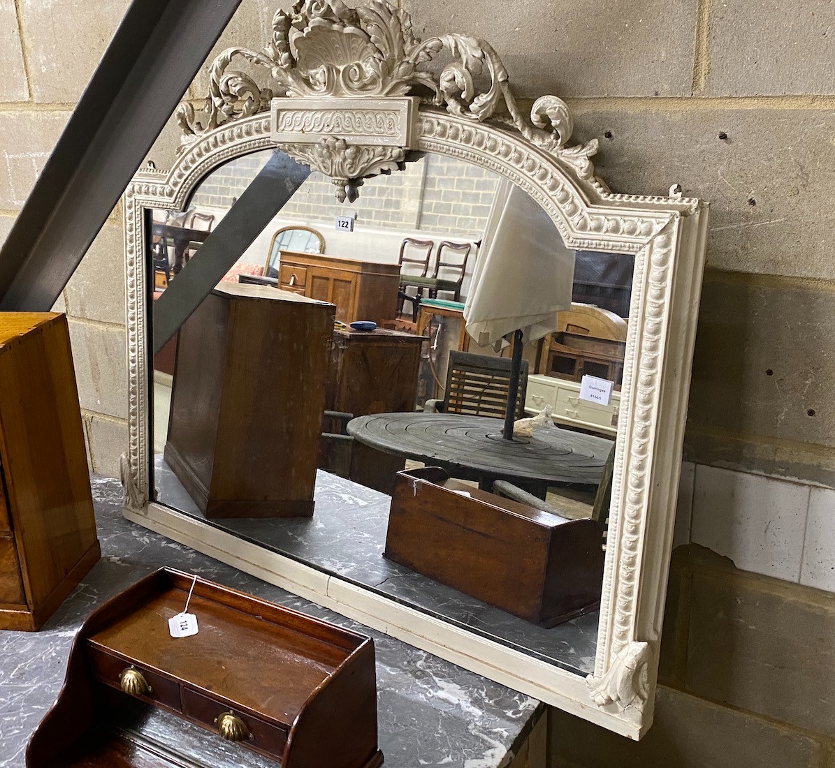A Victorian later painted carved wood and composition overmantel mirror, with pierced scrolling acanthus mounts, width 110cm, height 100cm